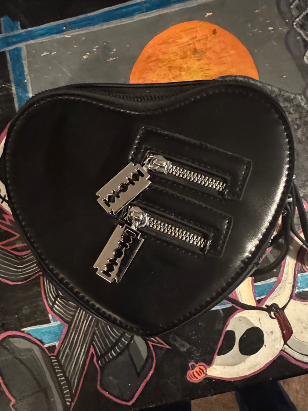 Black Heart-Shaped Crossbody Bag with Razor-Zip Accents